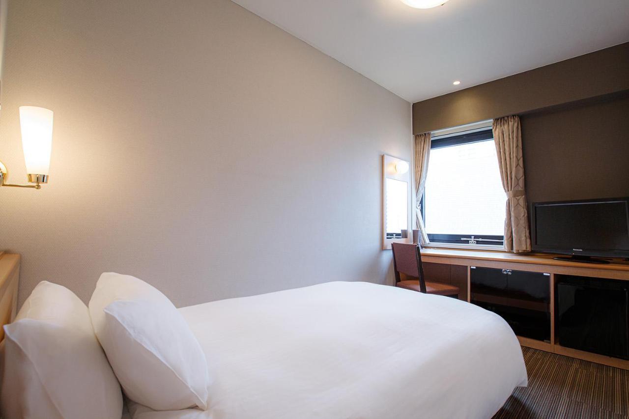 Harmonie Cinq Hotel Kitakyushu Bagian luar foto