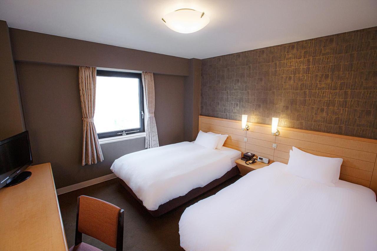 Harmonie Cinq Hotel Kitakyushu Bagian luar foto